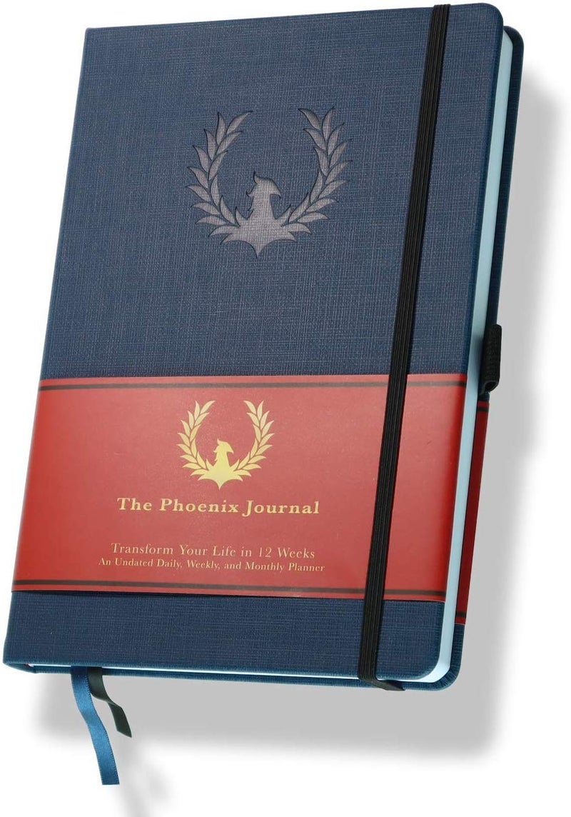 فينيكس بلانر The Phoenix Journal - أفضل منظم وتقويم لتخطيط الأهداف اليومية لتحديد الأهداف والامتنان والسعادة والإنتاجية - لوحة الرؤية وتتبع العادات - غلاف فني غير مؤرخ لمدة 12 أسبوعًا (ياقوتي) - Image 1